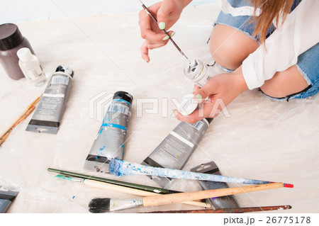 Painter working with dye on floor, top view Painter working with dye on floor, top view 26775178