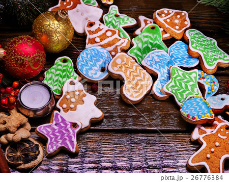 Pile of colorful cookies on a wooden table. Pile of colorful cookies on a wooden table. 26776384