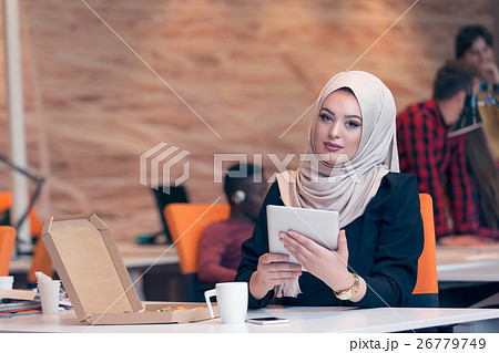 Arabic business woman wearing hijab,working in Arabic business woman wearing hijab,working in 26779749