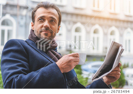 Happy man relaxing in cafe outside 26783494