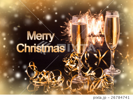 Glasses with champagne against holiday lights 26784741