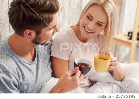 Cute loving couple relaxing in bedroom 26785198