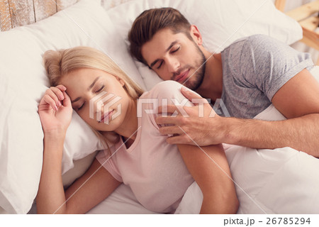 Cute married couple sleeping together Cute married couple sleeping together 26785294