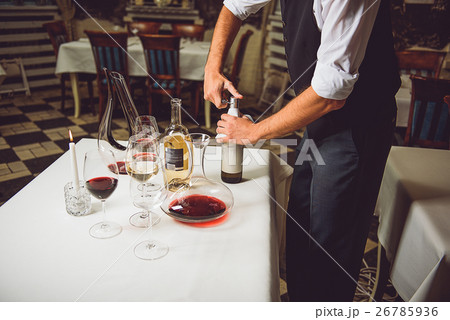 Opening bottle with white wine 26785936