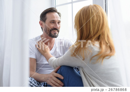 Loving senior couple hugging in bedroom 26786868