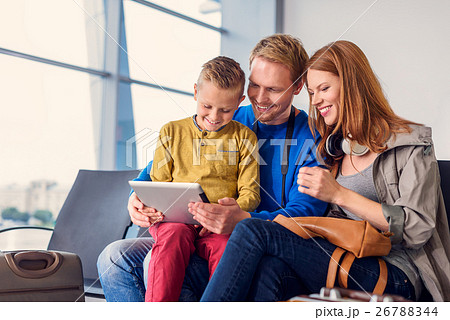 Family waiting for departure at airport 26788344