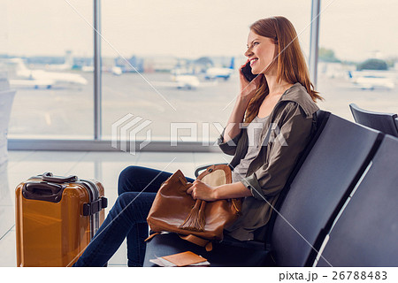 Smiling girl waiting for boarding 26788483