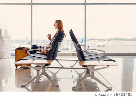 Nice girl idrinking coffee in airport Nice girl idrinking coffee in airport 26788486