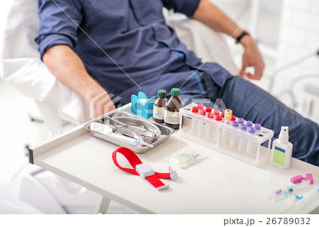 Male patient preparing for blood sampling 26789032