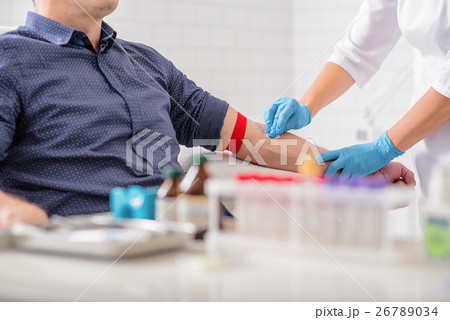 Professional doctor preparing patient for 26789034