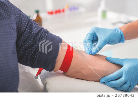 Man having blood collecting in hospital Man having blood collecting in hospital 26789042