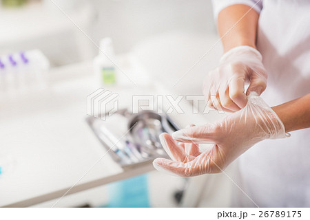 Female general practitioner wearing rubber 26789175