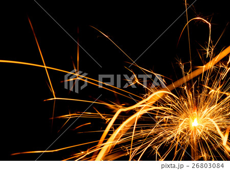 Christmas sparkler on black background Christmas sparkler on black background 26803084