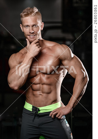 Strong and handsome athletic young man muscles Strong and handsome athletic young man muscles 26803861