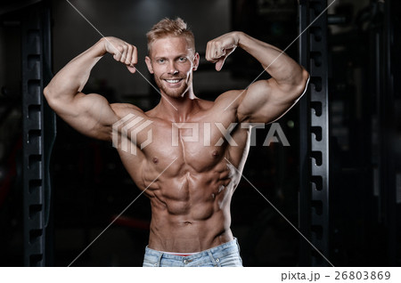Strong and handsome athletic young man muscles Strong and handsome athletic young man muscles 26803869