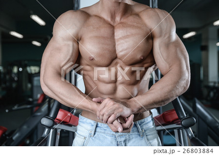 Strong and handsome athletic young man muscles Strong and handsome athletic young man muscles 26803884