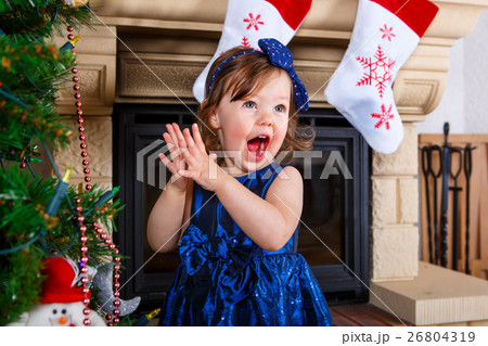 Adorable little kid girl celebrating Christmas Adorable little kid girl celebrating Christmas 26804319