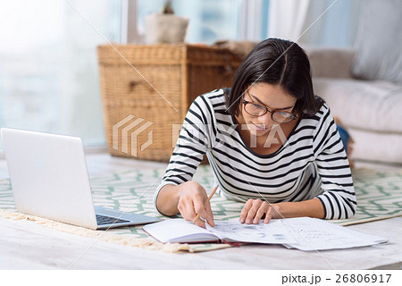 Involved charming woman working on the project at Involved charming woman working on the project at 26806917