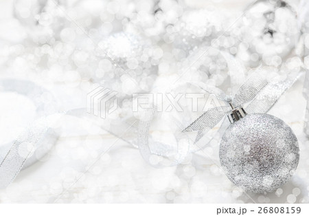 Silver Christmas ball on white spakles bokeh Silver Christmas ball on white spakles bokeh 26808159