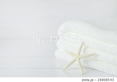 Starfish and pile of white towel on white wooden Starfish and pile of white towel on white wooden 26808543