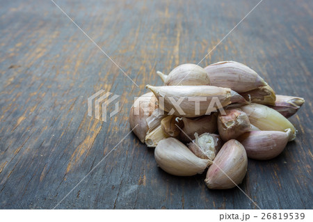 Garlic isolated on wood background. Garlic isolated on wood background. 26819539