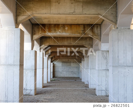 Colonnade of vertical supports under the bridge Colonnade of vertical supports under the bridge 26822501