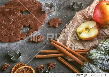 cutting gingerbread cookie with decorations cutting gingerbread cookie with decorations 26822731