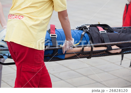 Paramedics evacuate an injured person Paramedics evacuate an injured person 26828120