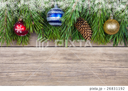 Christmas fir tree with toy on wooden background Christmas fir tree with toy on wooden background 26831192