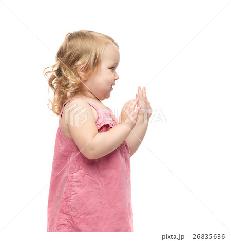 Young little girl standing over isolated white 26835636