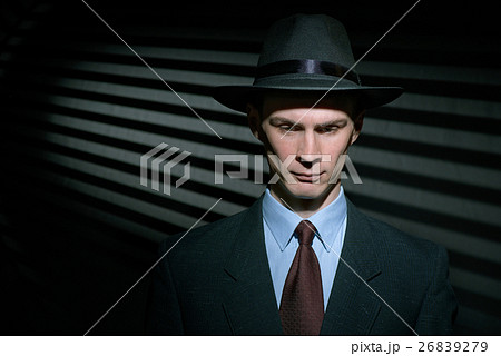 Fashionable young man detective in suit and trilby hat Fashionable young man detective in suit and trilby hat 26839279