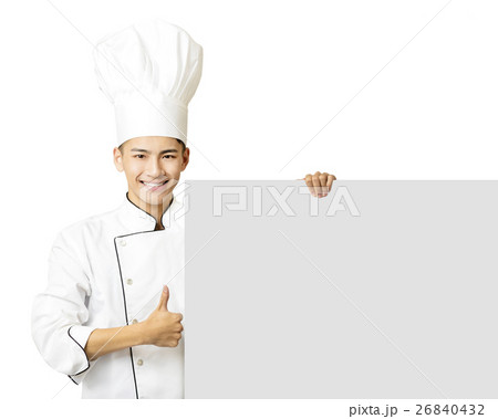 young chef with thumb up and showing empty board young chef with thumb up and showing empty board 26840432