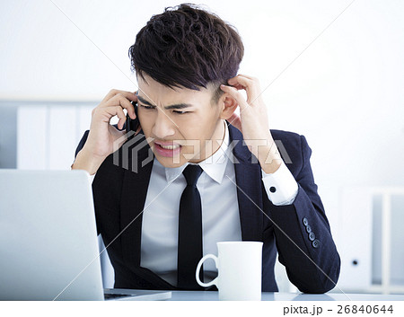 Businessman having stress in the office Businessman having stress in the office 26840644