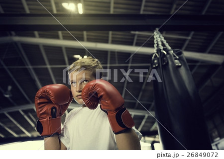 Boy Boxing Training Punching Bag Exercise Concept 26849072