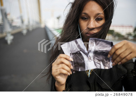 African Woman Sadness Listening Music Tearing Photo Breakup Concept 26849078