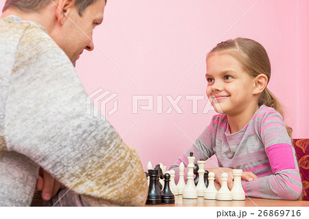 Dad and daughter happily look at each other Dad and daughter happily look at each other 26869716