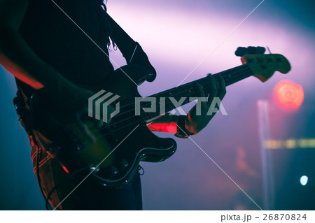 Silhouette of bass guitar player on stage Silhouette of bass guitar player on stage 26870824