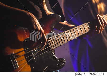 Close-up photo, bass guitar player Close-up photo, bass guitar player 26870831