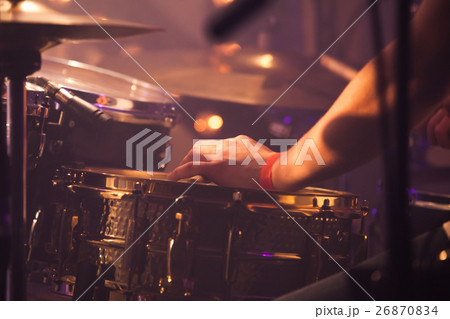 Drummer plays on drum set, toned Drummer plays on drum set, toned 26870834