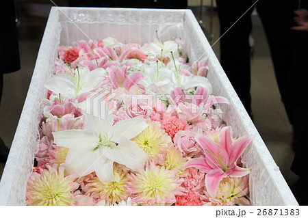 A Coffin Filled With Fresh Flowers Stock Photo