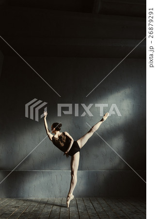 Flexible ballet dancer stretching in the dark Flexible ballet dancer stretching in the dark 26879291