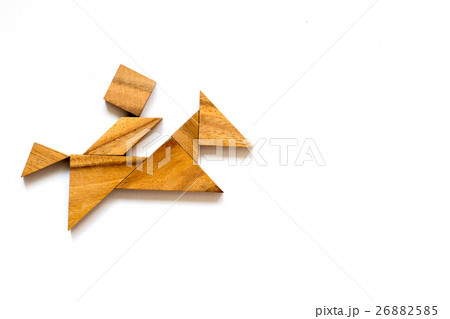 Wooden tangram as man riding horse shape Wooden tangram as man riding horse shape 26882585
