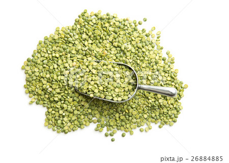 Green split peas in metal scoop. Green split peas in metal scoop. 26884885