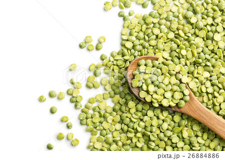 Green split peas in wooden spoon. Green split peas in wooden spoon. 26884886
