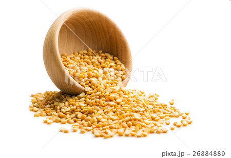 Yellow split peas in wooden bowl. Yellow split peas in wooden bowl. 26884889