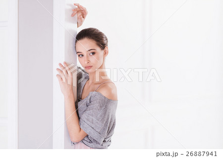 Portrait of serious woman looking sideways 26887941