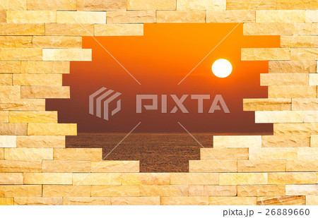 Crashed Brick Wall with sun set over the sea 26889660
