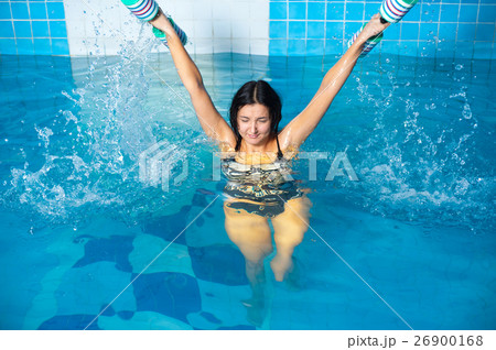 Attractive girl trains in aqua aerobics 26900168