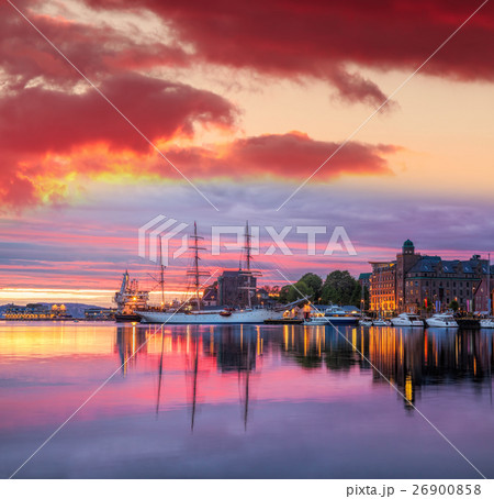 Bergen harbor with boats against sunset in Norway Bergen harbor with boats against sunset in Norway 26900858