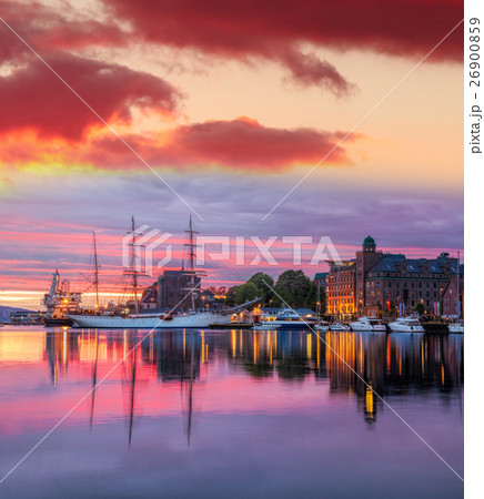 Bergen harbor with boats against sunset in Norway Bergen harbor with boats against sunset in Norway 26900859